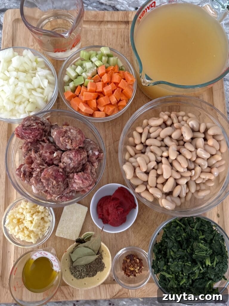 One-Pot White Bean and Sausage Soup 3 All ingredients for Sausage and Cannellini Beans Soup on cutting board.