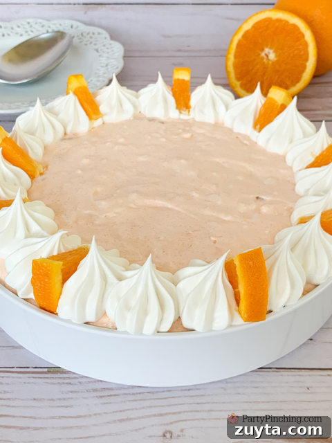 Classic Cottage Cheese Jello Salad Recipe 4 cottage cheese jello salad, easy 5 minute jello salad, orange fluff salad, 4 ingredient salad, creamsicle salad, easiest salad for summer, orange fluff dessert, cottage cheese dessert, vintage dessert salad recipe ideas, easy best potluck dessert salad side dishes