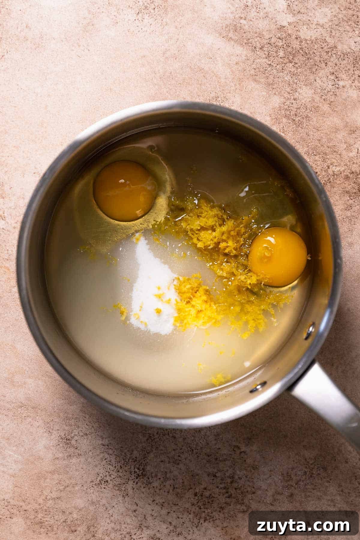 Lemon Curd Recipe: Homemade, Smooth, Zesty 3 Ingredients for lemon curd in a pot before whisking.