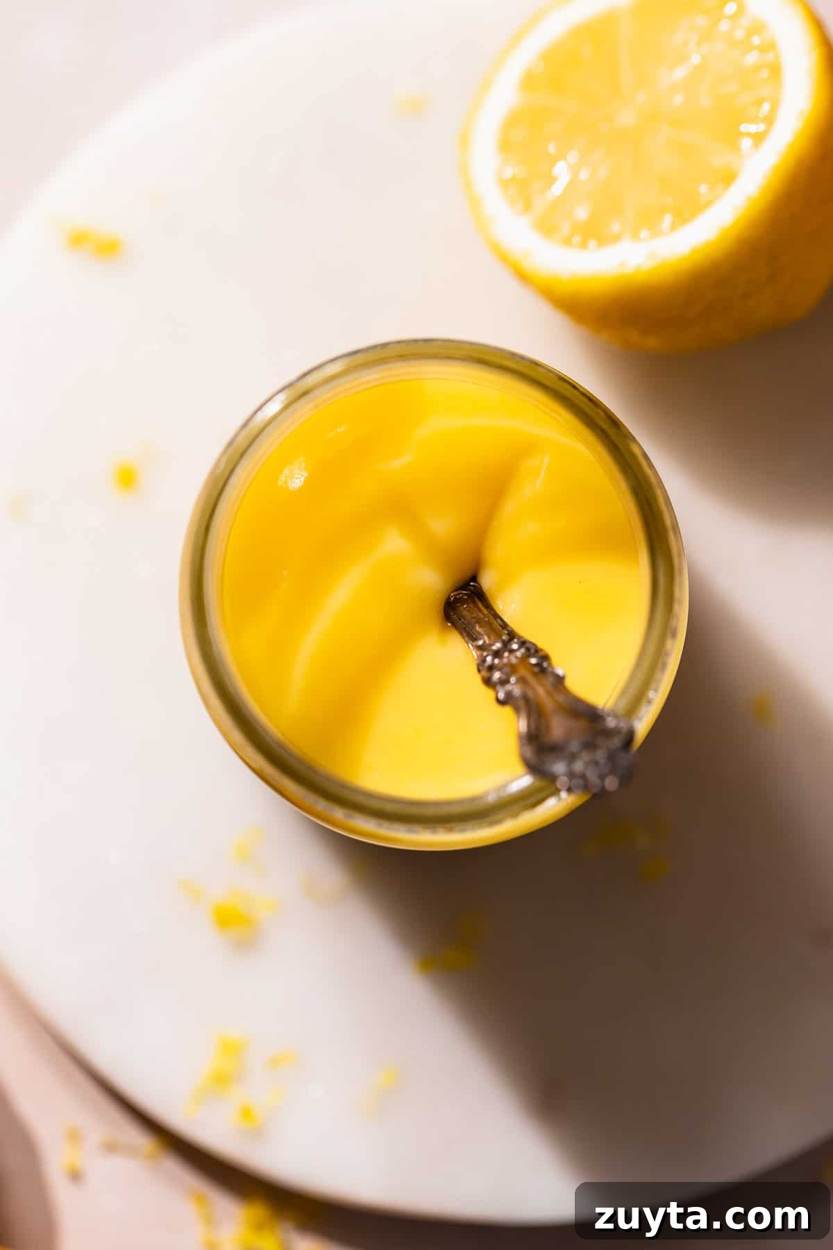 Lemon Curd Recipe: Homemade, Smooth, Zesty 8 A glass mason jar full of homemade lemon curd.