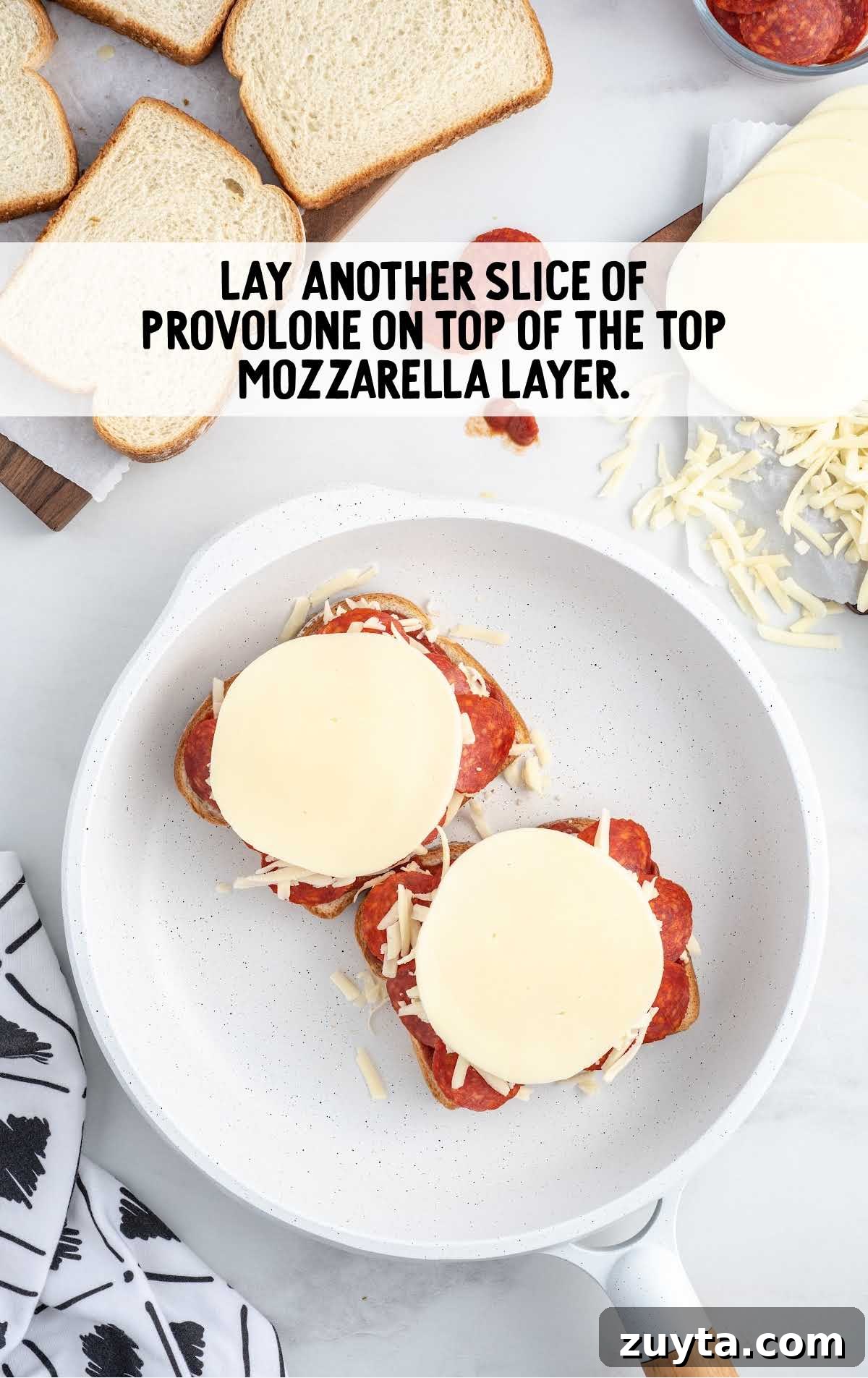 slices of provolone placed on top of the shredded mozzarella 