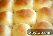 Three rows of Baked Lunch Lady Cafeteria Rolls for a total of nine rolls.