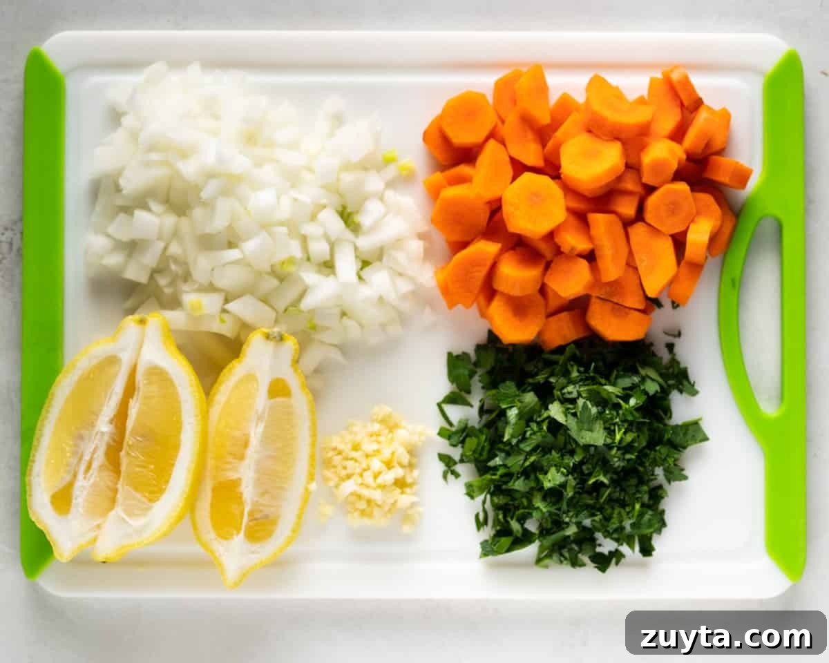 cutting board showing chopped vegetables needed for this soup