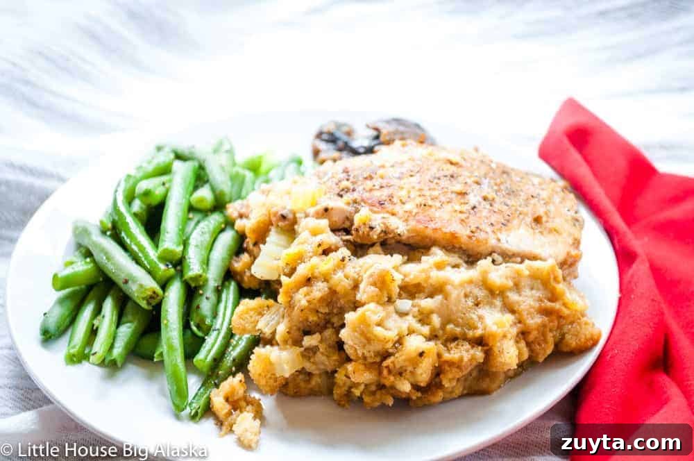 Foolproof Pork Chop Recipes for Juicy Weeknight Dinners 14 A stuffed chop on a plate with green beans.