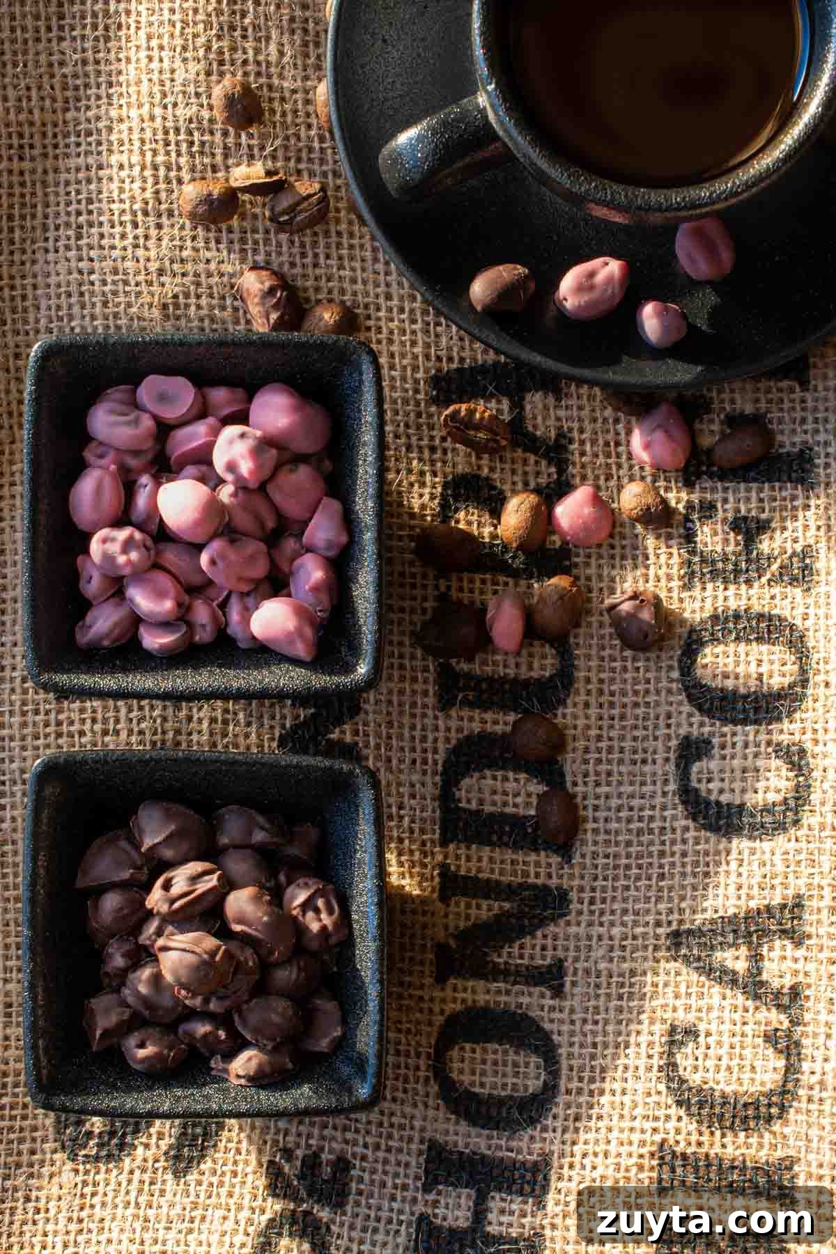 How to Make Chocolate Covered Coffee Beans at Home 2 Ruby and dark chocolate covered coffee beans in black pots, on a coffee sack background.