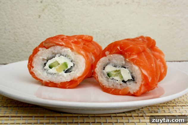Philadelphia Roll with Salmon and Creamy Avocado 2 Creamy Avocado Salmon Philadelphia Sushi Rolls: A step-by-step recipe of the most popular sushi rolls with salmon, avocado and cream cheese. The best you can do with only 6 ingredients!