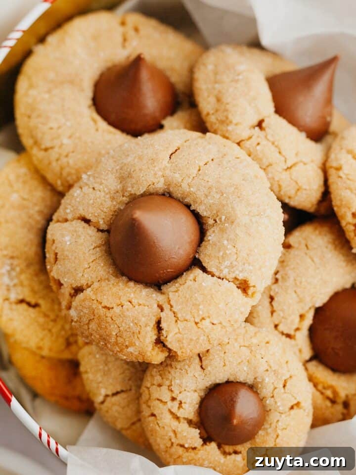 Peanut butter thumbprint cookies in a tin.