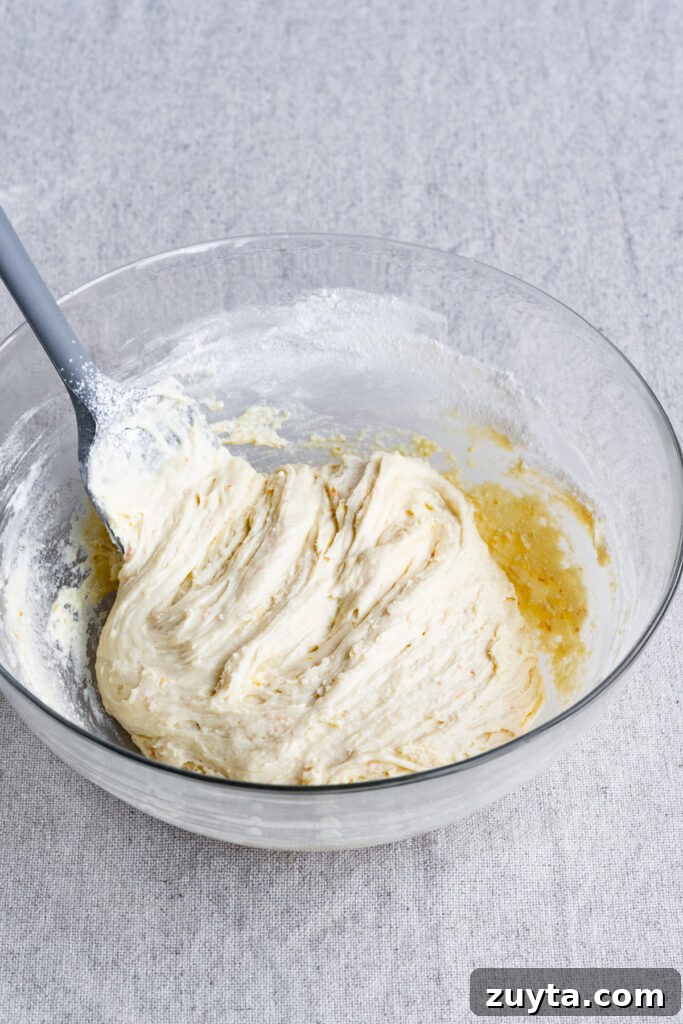 Crisp Fig and Almond Biscotti Recipe 4 Biscotti dough in a large bowl with a silicone spatula.