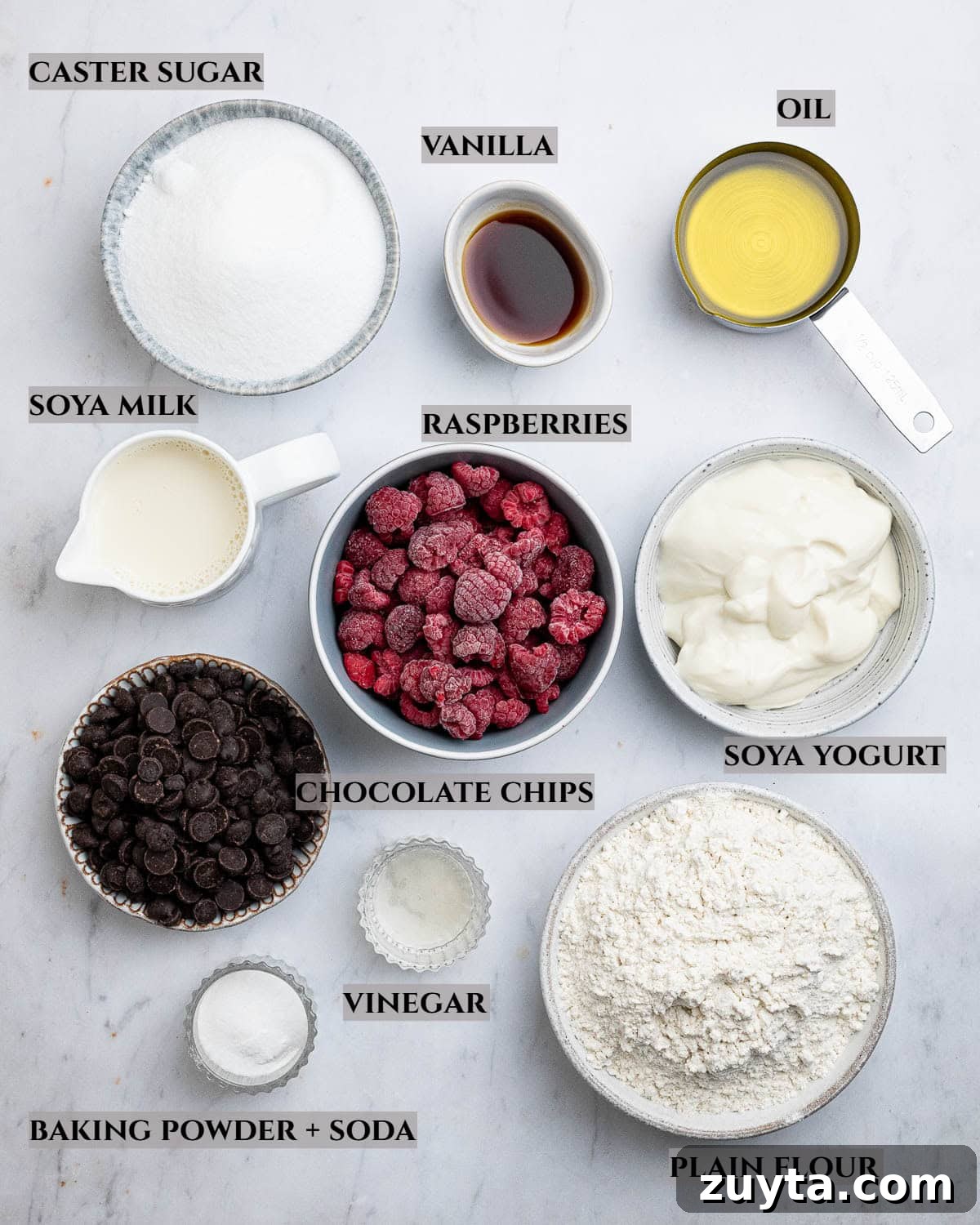 Vegan Chocolate Chip Raspberry Muffins Recipe 2 A labelled photo of the ingredients needed to make choc chip raspberry muffins.