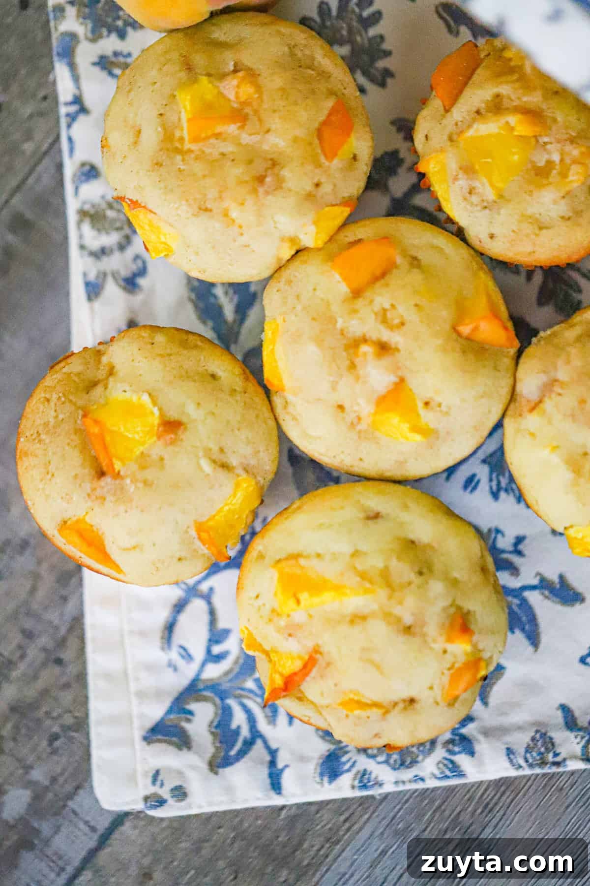 Peach Muffins with Crumble Topping Recipe 4 mixing bowl with muffin batter and chopped peaches folded in