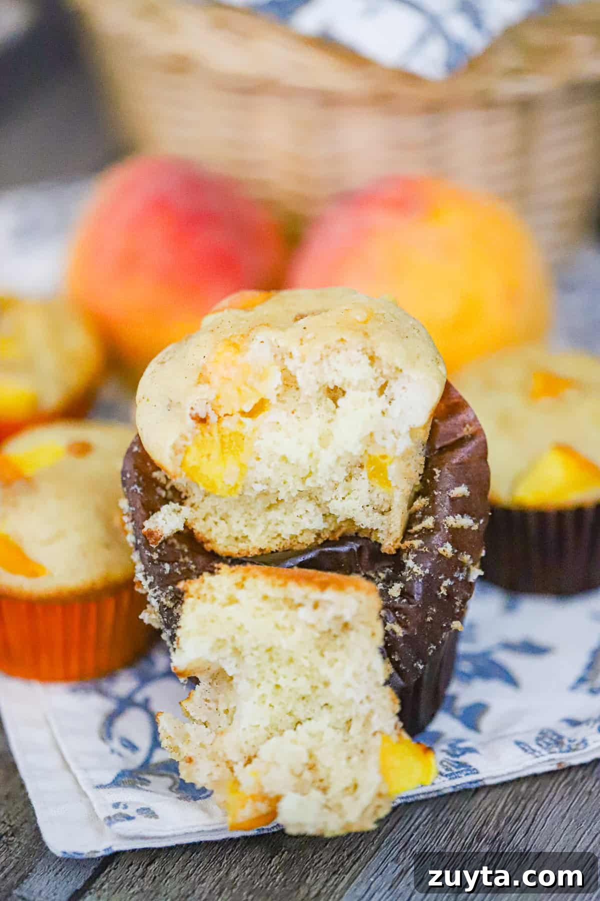 Peach Muffins with Crumble Topping Recipe 5 peach crumble muffins cooling on rack