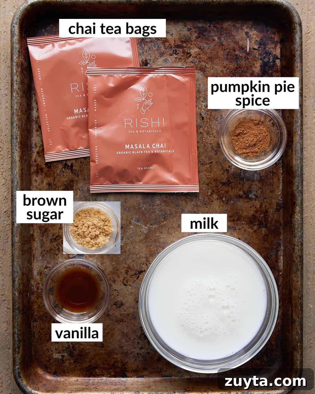 Homemade Pumpkin Spice Chai Latte Recipe 3 An overhead image of ingredients needed to make pumpkin spice chai latte.