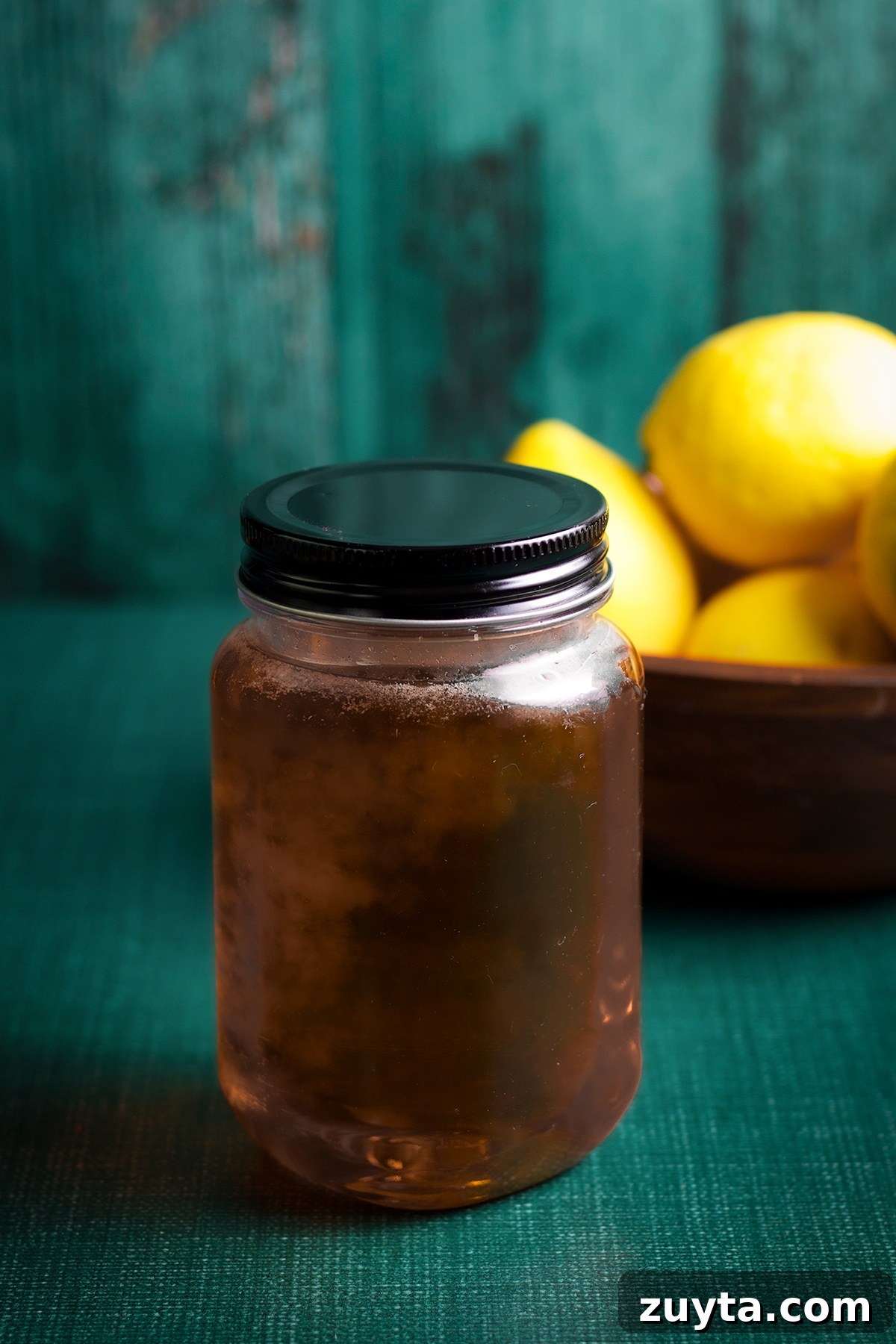 How to Make Candied Lemon Slices for Garnish and Snacks 8 A jar of candied lemon syrup.