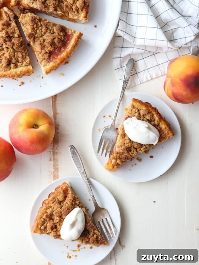 How to Make Silky, Stable Whipped Cream 6 Two slices of peach crumb pie with whipped cream on top