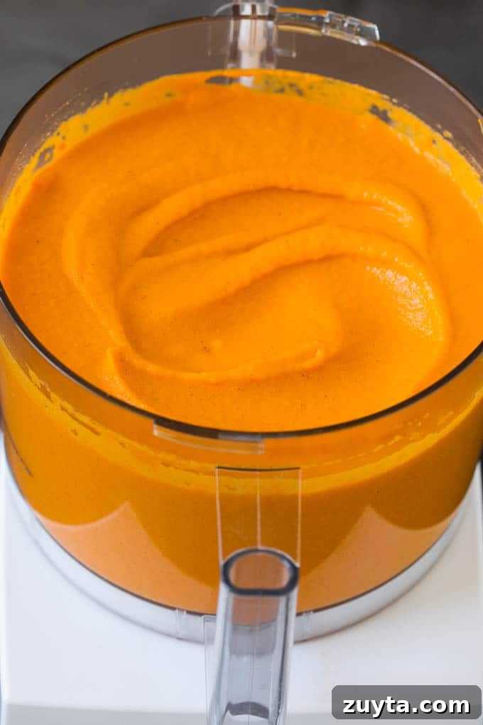 Carrot puree in a food processor. Carrot puree in a food processor.