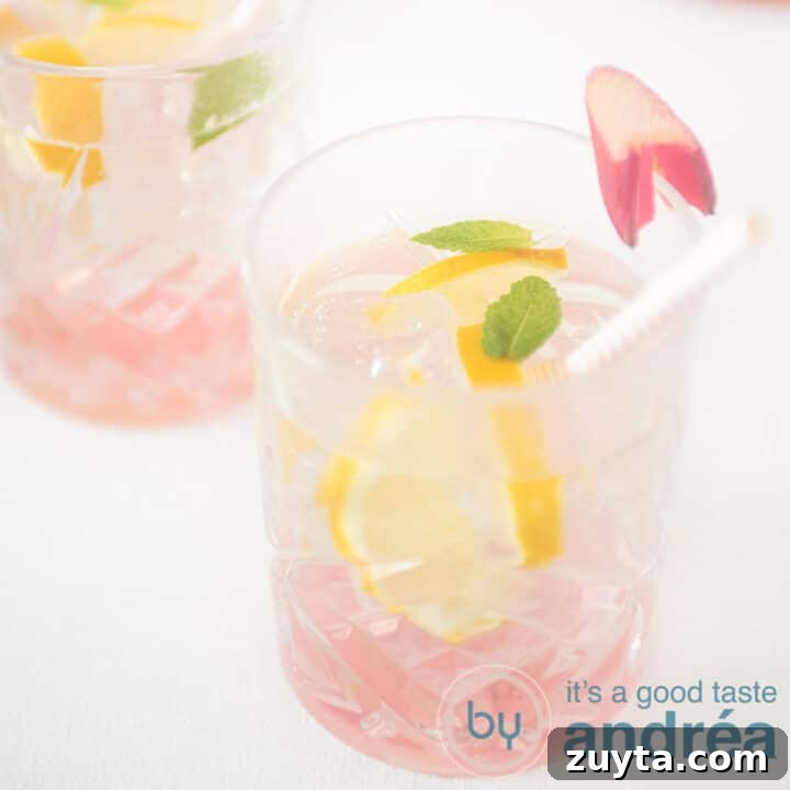 A square photo with two glasses filled with rhubarb iced tea on a white background