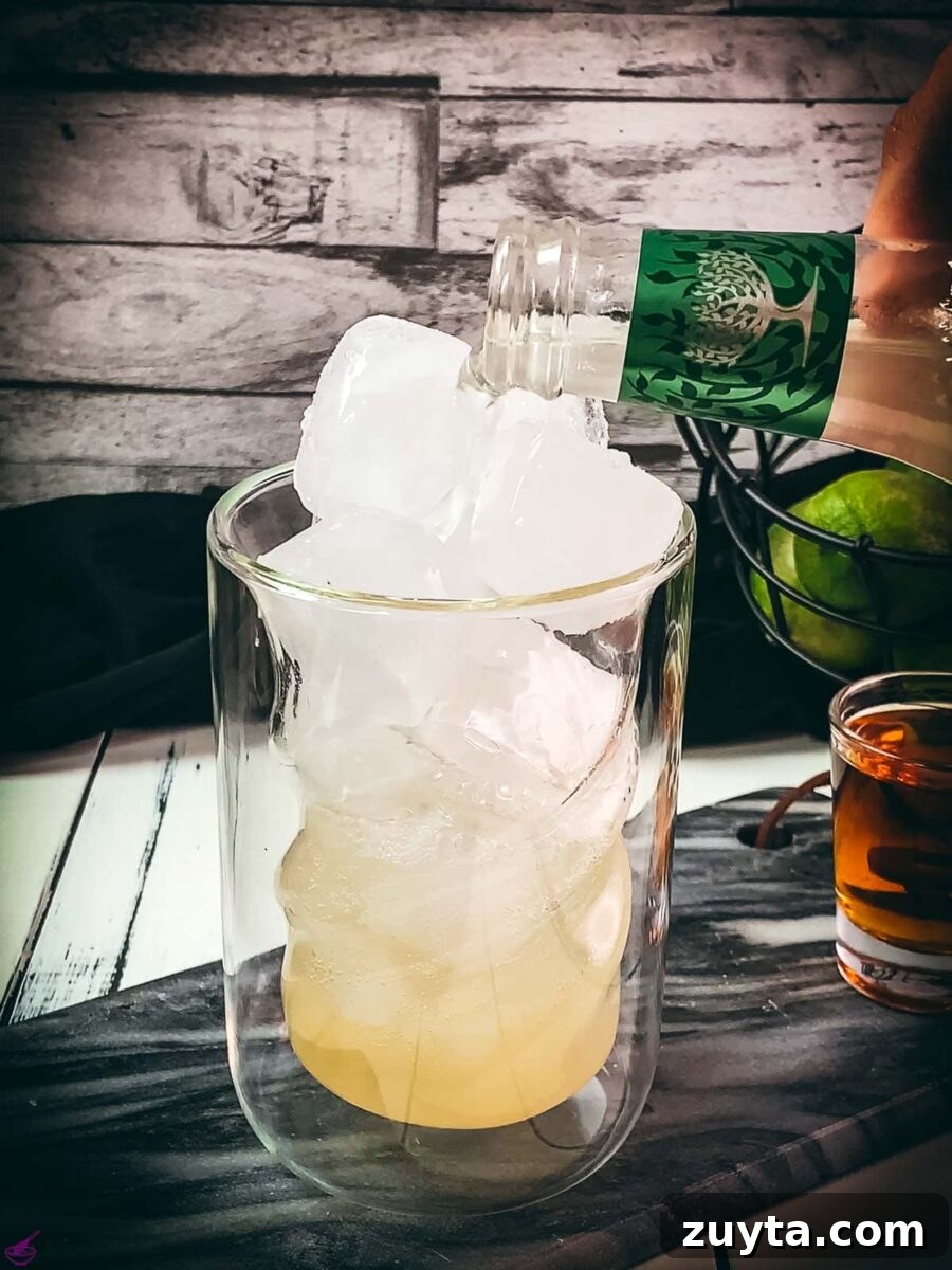 How to Make a Classic Dark and Stormy Cocktail 5 Top off with ginger beer.