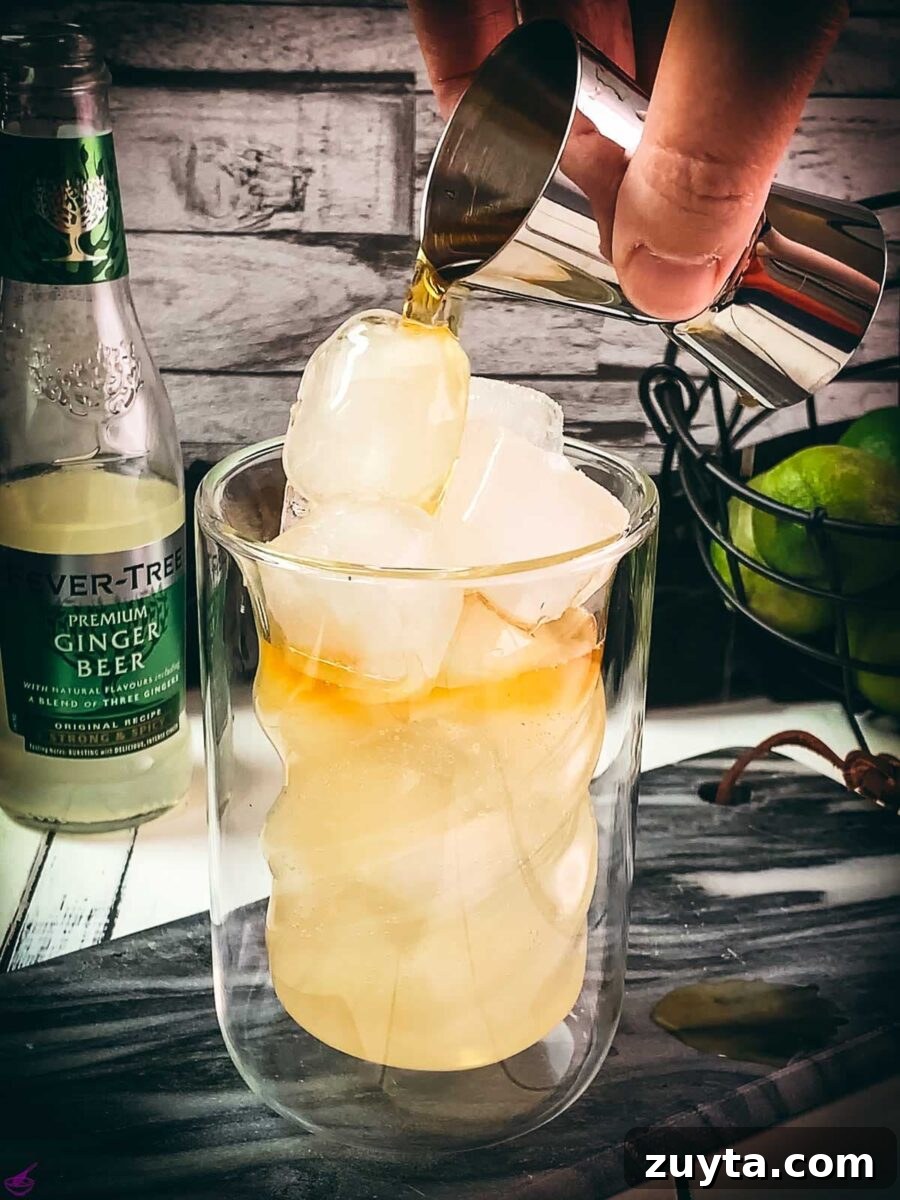 How to Make a Classic Dark and Stormy Cocktail 6 Add the dark rum last.