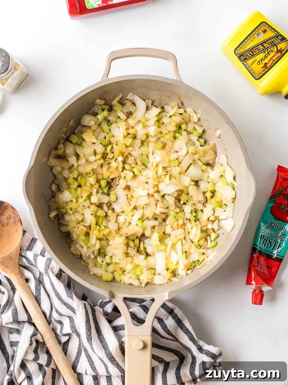 Sloppy Joe Sliders Recipe for Game Day and Parties 4 Sautéed onions, celery, and garlic in a skillet.