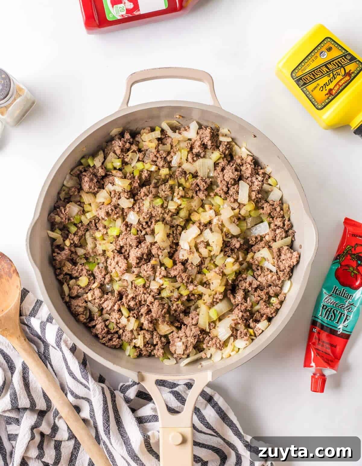 Sloppy Joe Sliders Recipe for Game Day and Parties 5 Cooked ground beef in a skillet with celery and onion.