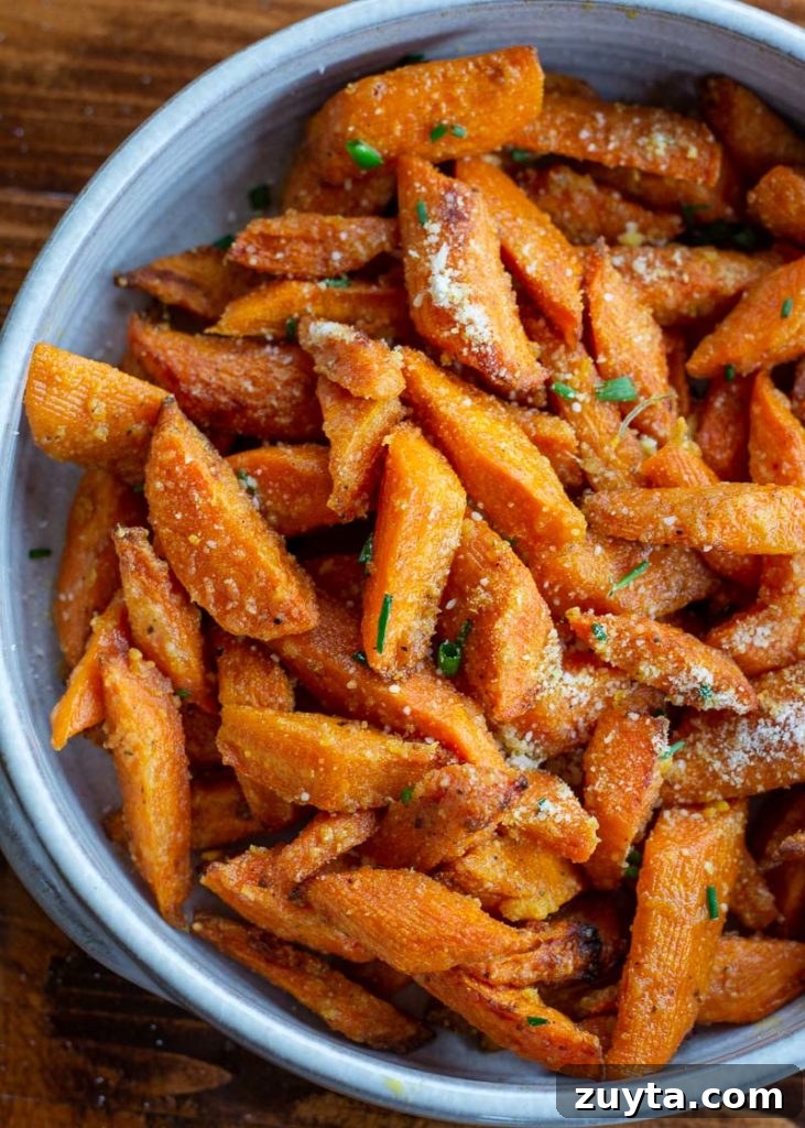 Crispy Air Fryer Carrots Recipe 2 These Air Fryer Carrots are tossed in olive oil, parmesan and spices! These roasted carrots are perfectly tender on the inside and crisp on the outside.