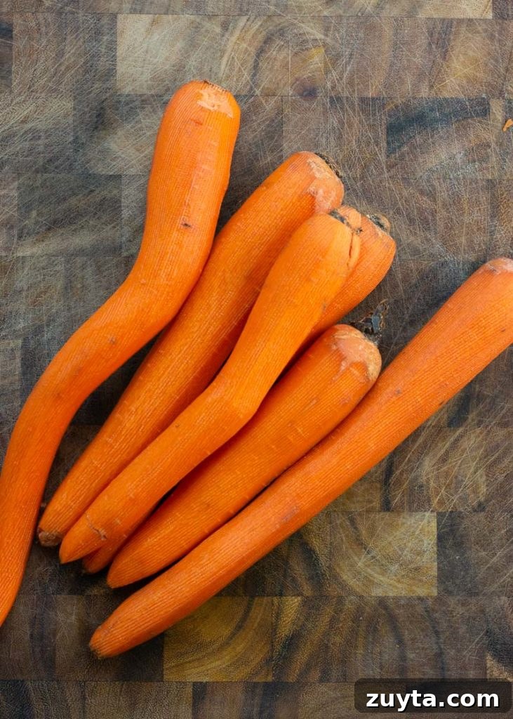 Crispy Air Fryer Carrots Recipe 3 These Air Fryer Carrots are tossed in olive oil, parmesan and spices! These roasted carrots are perfectly tender on the inside and crisp on the outside.