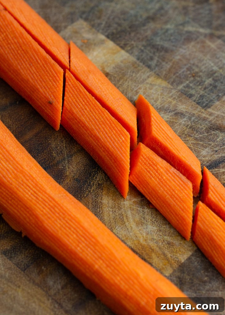 Crispy Air Fryer Carrots Recipe 4 These Air Fryer Carrots are tossed in olive oil, parmesan and spices! These roasted carrots are perfectly tender on the inside and crisp on the outside.