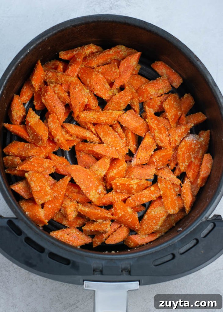 Crispy Air Fryer Carrots Recipe 7 These Air Fryer Carrots are tossed in olive oil, parmesan and spices! These roasted carrots are perfectly tender on the inside and crisp on the outside.