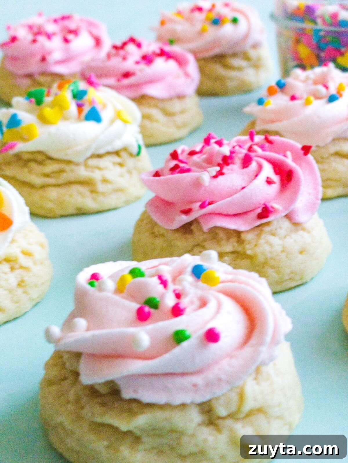 Mini sugar cookies frosted with a buttercream swirl
