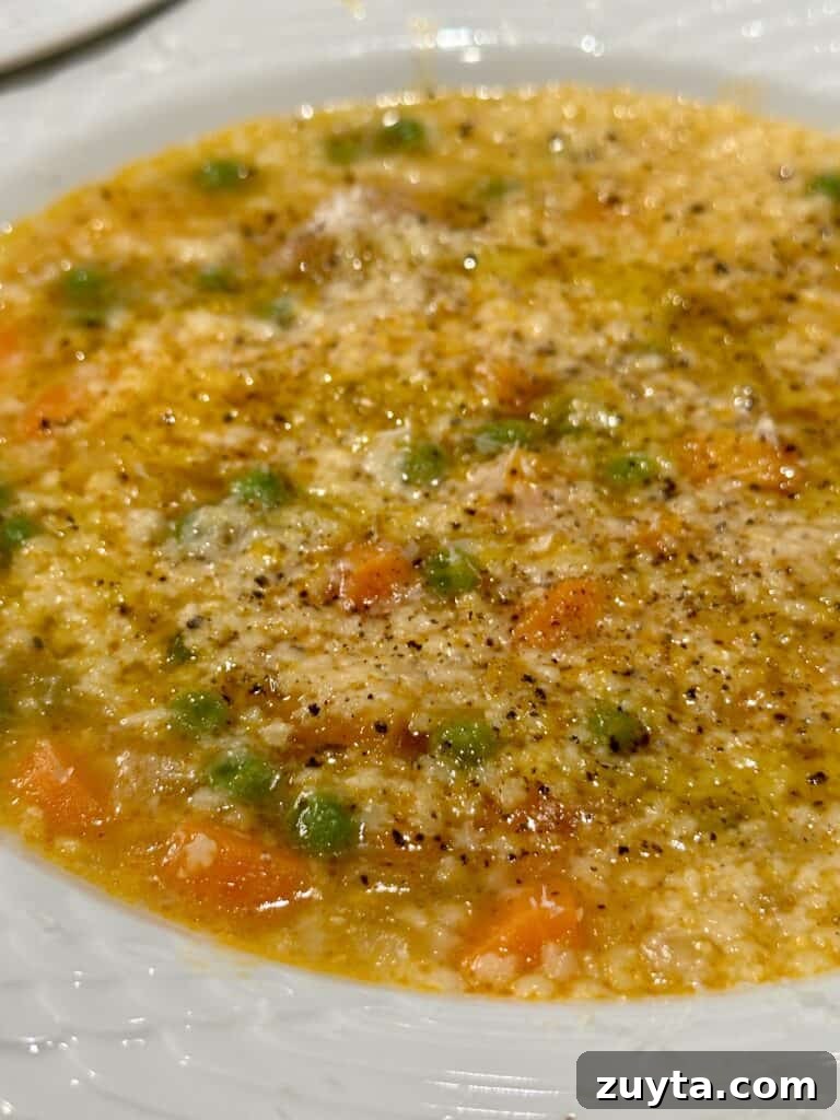 Bowl of pastina with peas and parmigiano