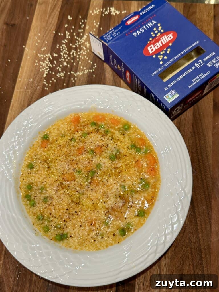 Close-up of pastina in a bowl with grated cheese