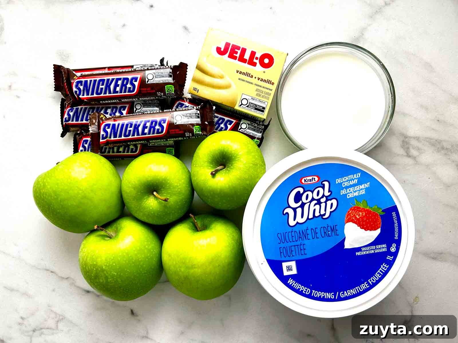 Snickers Salad Recipe: Creamy No-Bake Dessert with Apples 4 ingredients prepped in bowls.