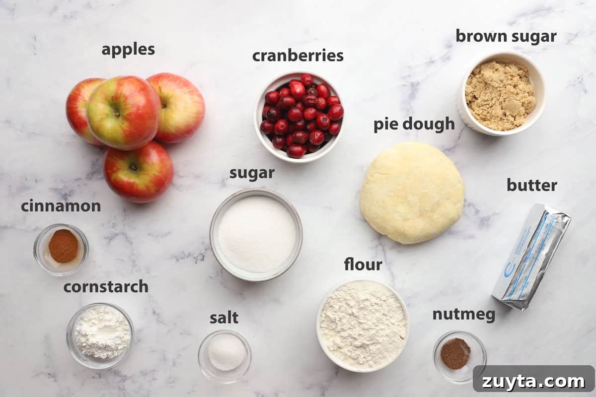 Rustic Apple Cranberry Crumble Pie Recipe 4 ingredients pictured and labelled for apple cranberry crumble pie