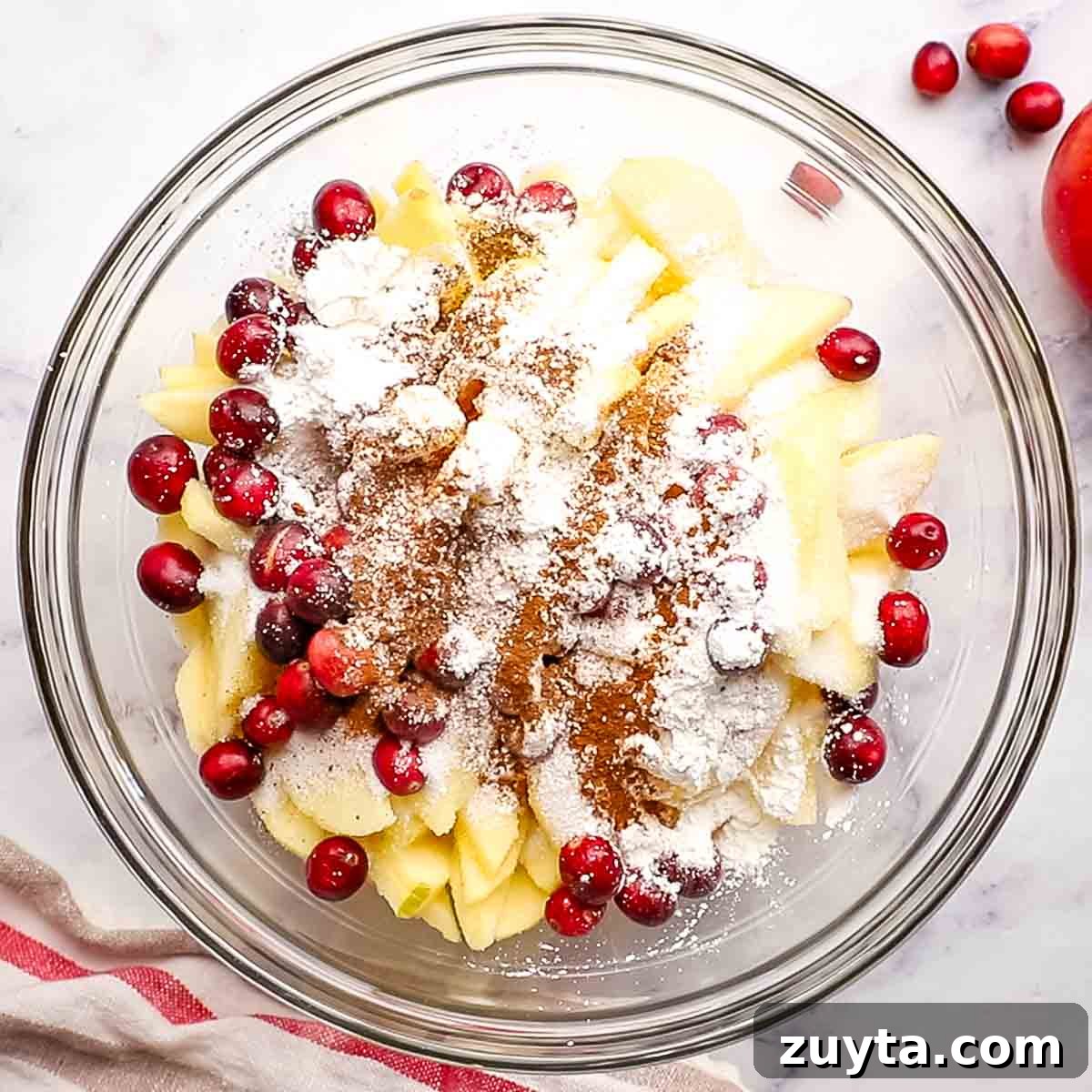 Rustic Apple Cranberry Crumble Pie Recipe 7 fresh fruits and ingredients for pie filling in a big bowl