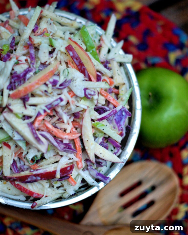 Finished bowl of apple coleslaw with homemade buttermilk dressing.