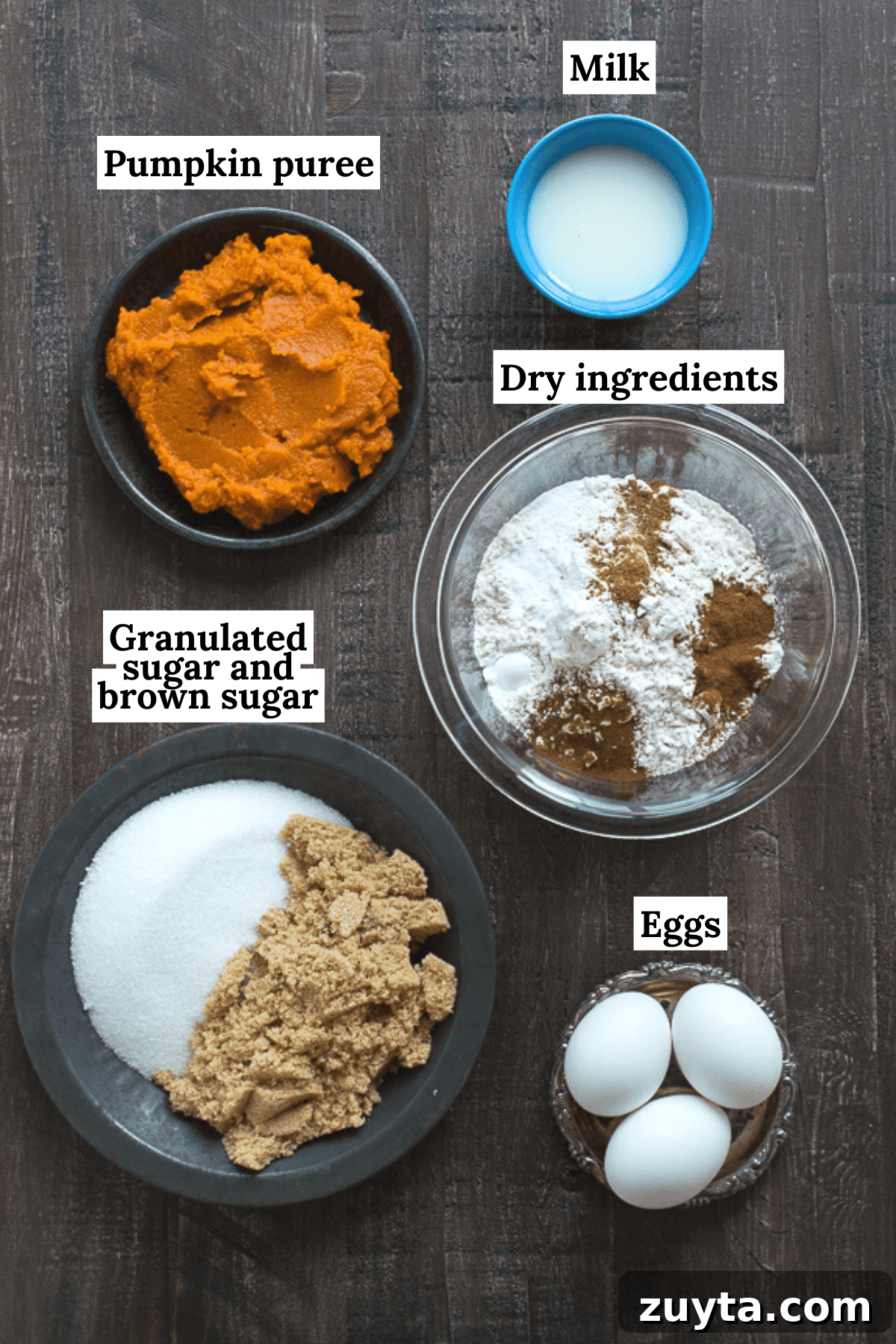 This Pumpkin Pound Cake recipe tastes just like Starbucks Pumpkin Pound Cake - takes 15 minutes to prep! Can be made in muffin, mini muffin or mini loaf pans. ingredients to make easy pumpkin bread on dark background