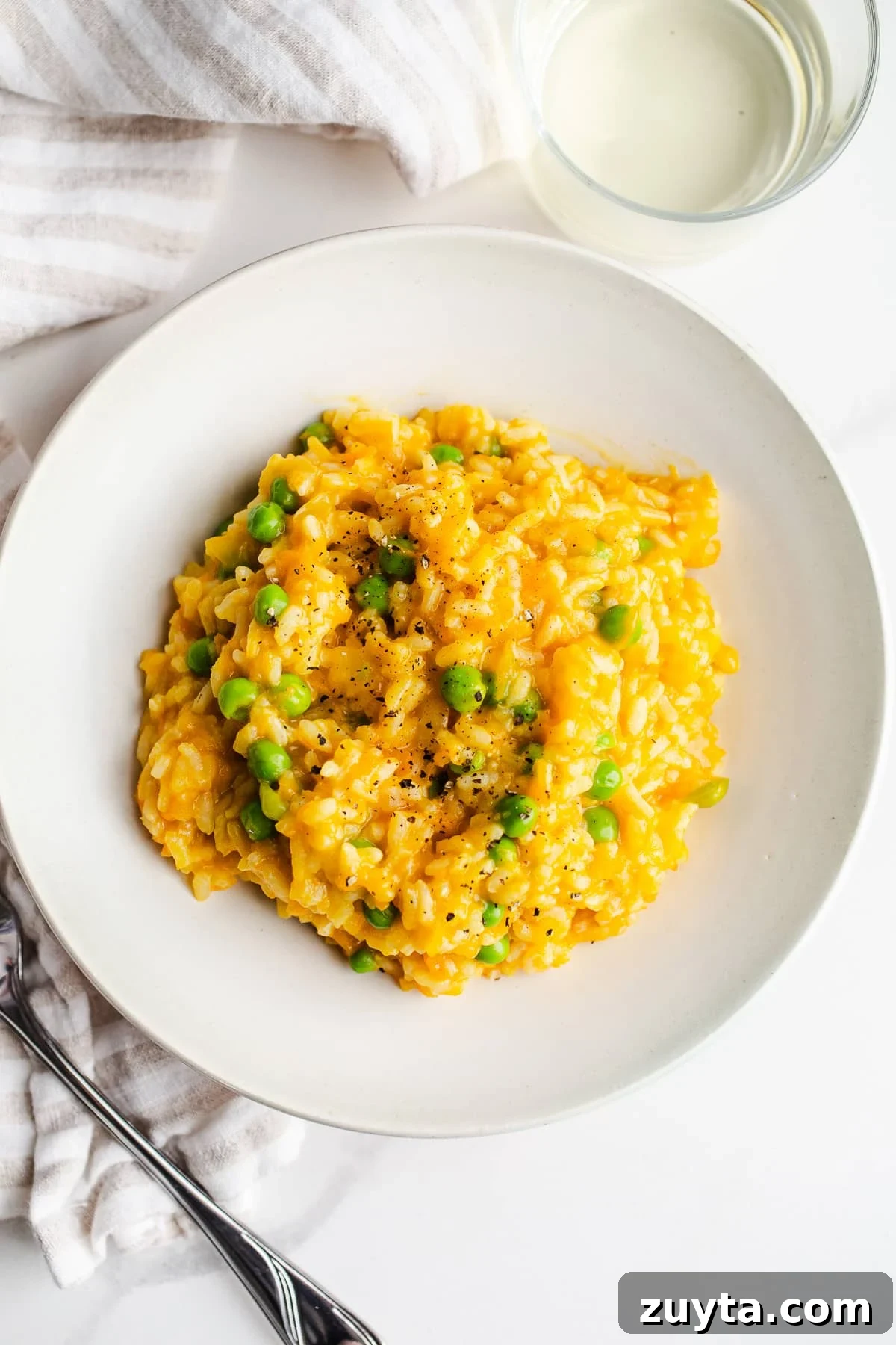 A serving of risotto in a dish.