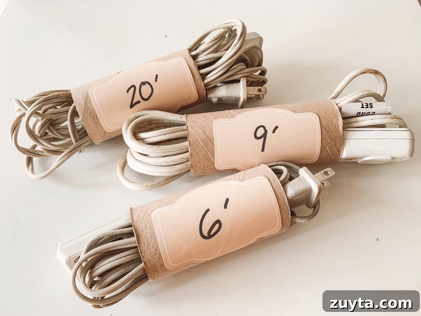 20. Toilet Paper Cord and Wire Organizers