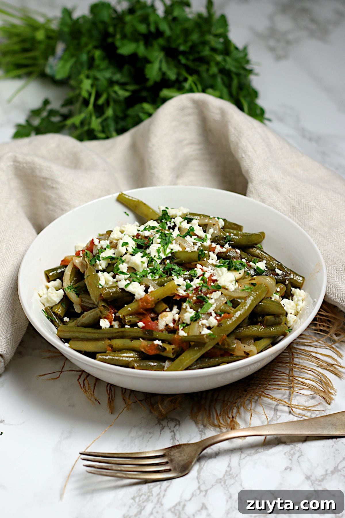 Greek-Style Green Beans in a white bowl.