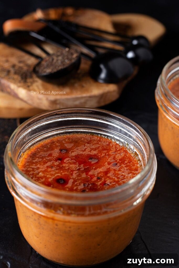 Silky Thai Tea Crème Brûlée Recipe 7 Angled view of our Thai tea crème brûlée served in a glass jar.