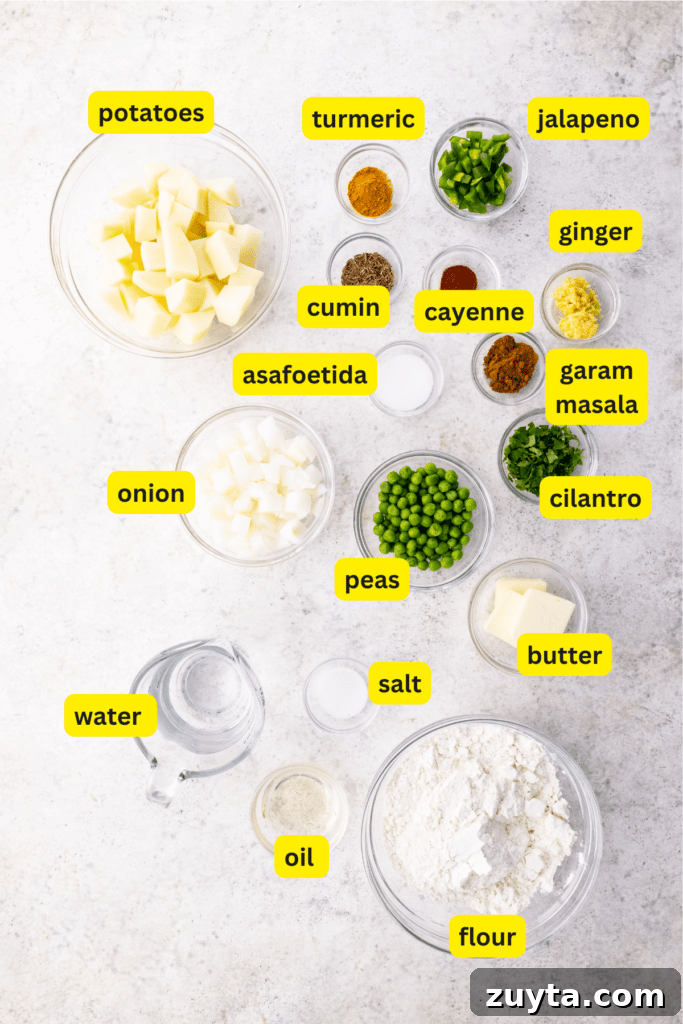 Homemade Samosa Filling: Spiced Potato and Pea Mix 2 Various ingredients for making potato samosas laid out on a kitchen countertop