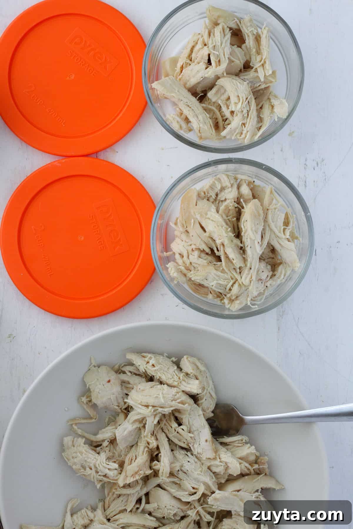 Flavorful Dutch Oven Pulled Chicken Recipe 7 Dutch oven pulled chicken portioned into a containers for meal prep.