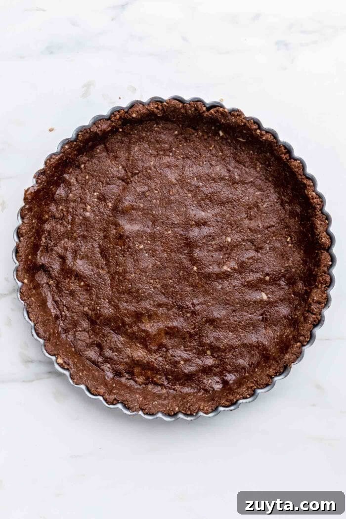 Creamy No-Bake Vegan Peanut Butter Pie 4 Chocolate pie crust pressed into a pie tin.