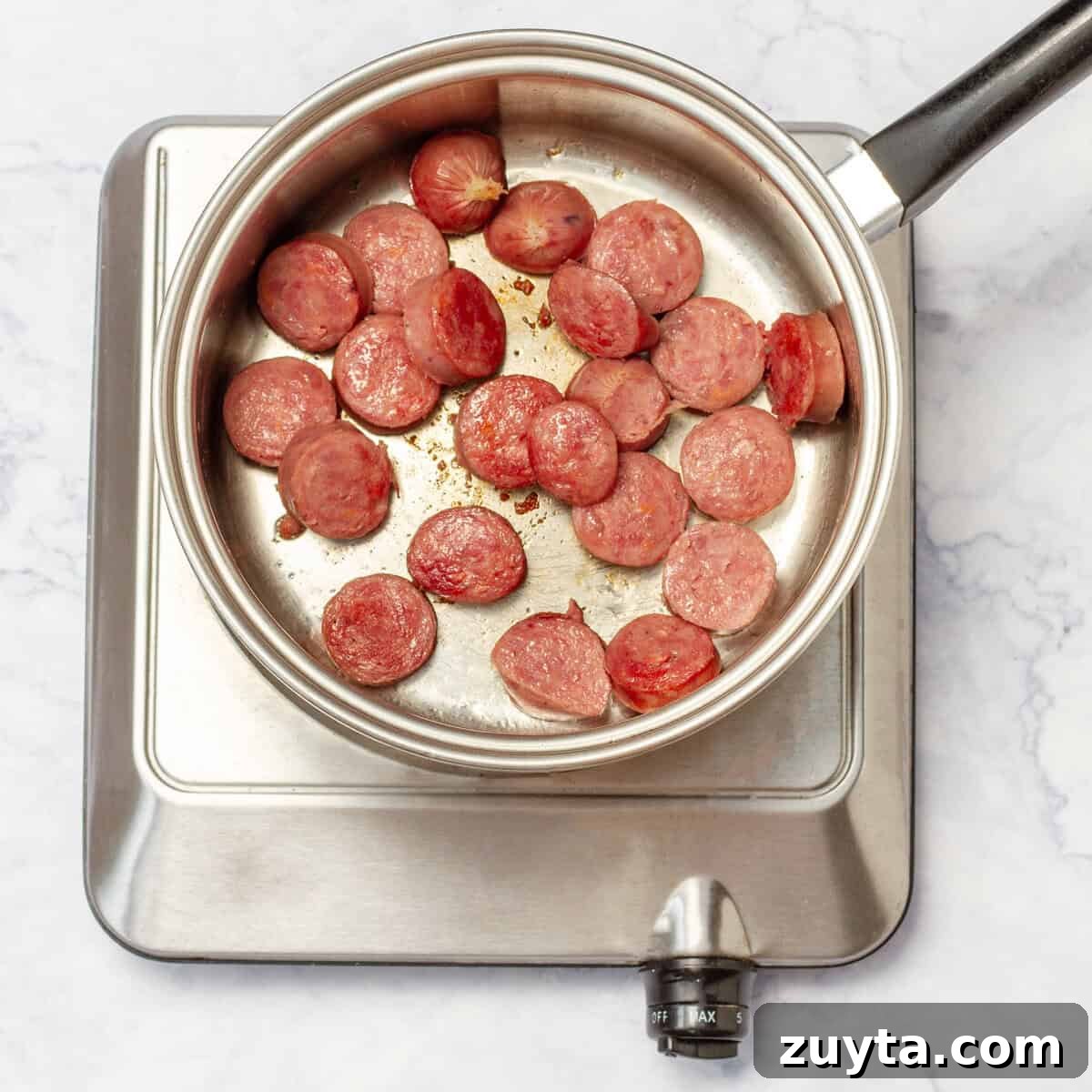 brown the sliced turkey sausage over medium heat