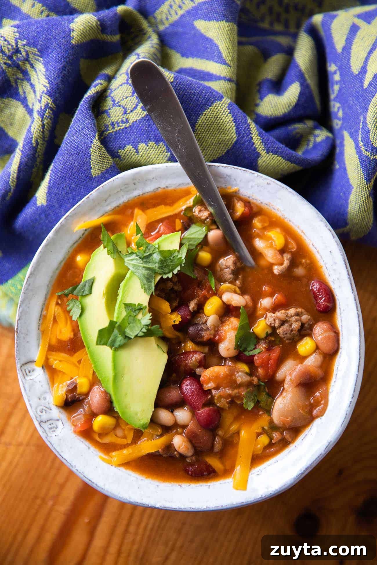 15-Bean Taco Soup Recipe 3 overhead photo of soup with beans, meat and cheese