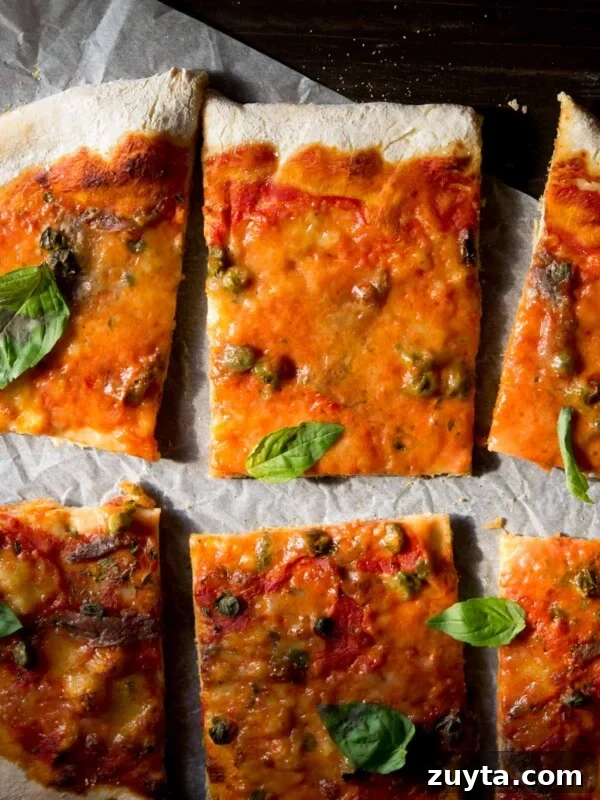 A close up of anchovy pizza (pizza napoli) with capers
