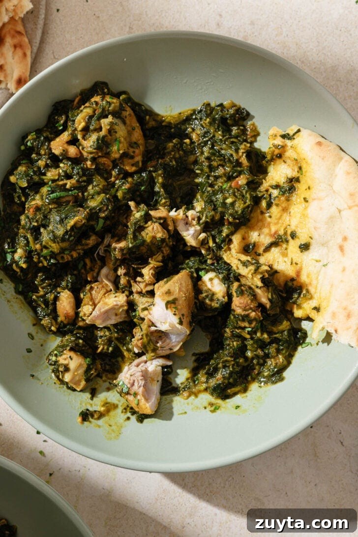 Creamy Chicken Saag with Spinach 10 Partially eaten plate of Palak Chicken with naan