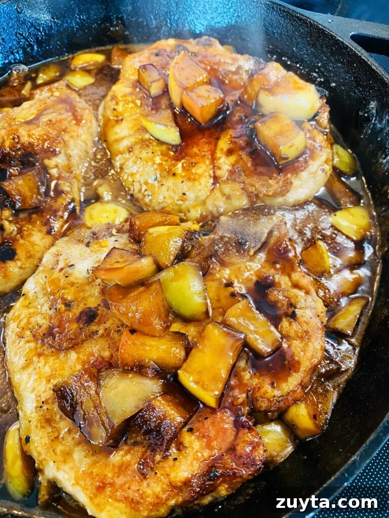 Apple Bourbon Glazed Pork Chops Recipe 7 adding pork back into the skillet with apples and sauce