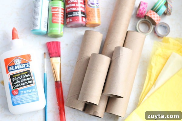How to Make a Menorah from Toilet Paper Rolls 4 cardboard rolls, paint, glue, paintbrushes, washi tape, tissue paper