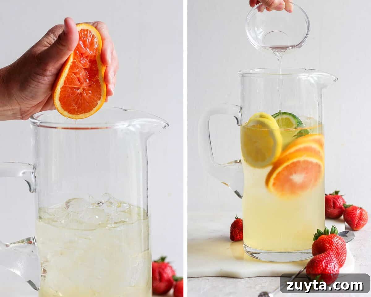 White Sangria Recipe with Citrus and Fresh Berries 5 Fresh citrus juice being added to the pitcher and simple syrup being poured.